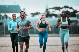 Sculpting Sleek Arms: The Essential Role of Cardio in Toning Without Bulking Up 3 image of people running to incorporate cardio Sudbury exercise into their life to help tone arms and body.